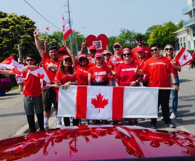 People-at-walk-the-walk holding Canada's flag