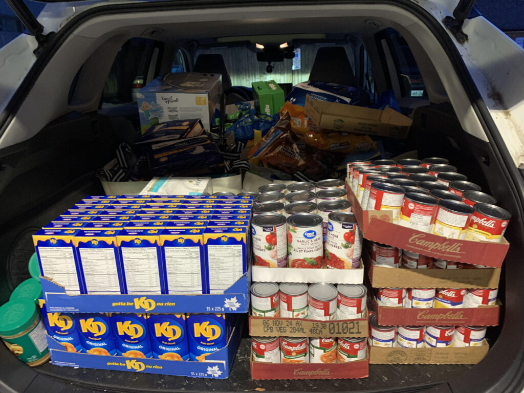 Food donations from a community partner supporting The Compass Food Bank