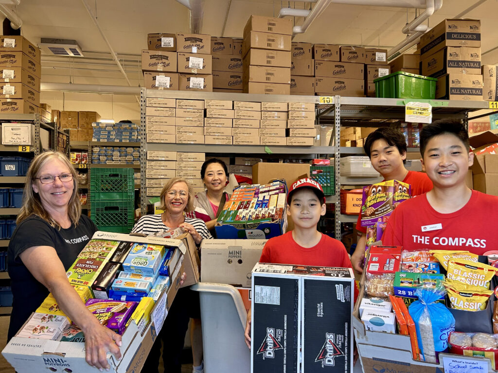 People with bin of donations
