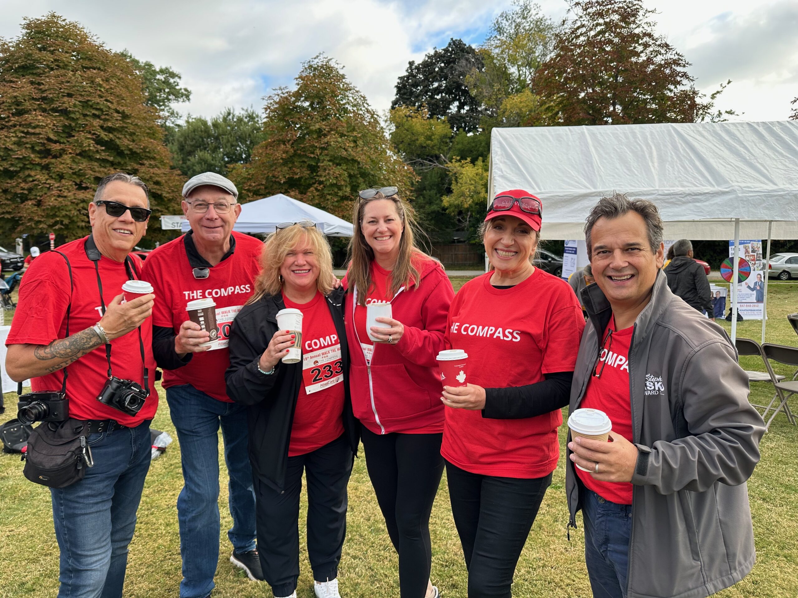 Community team participating in a fundraising walk for The Compass Food Bank.